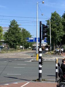 image shows bike traffic signal pole (note it is facing the oncoming bike users on the near side)