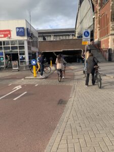 image of the bike path under the Amsterdam Centraal Train Station